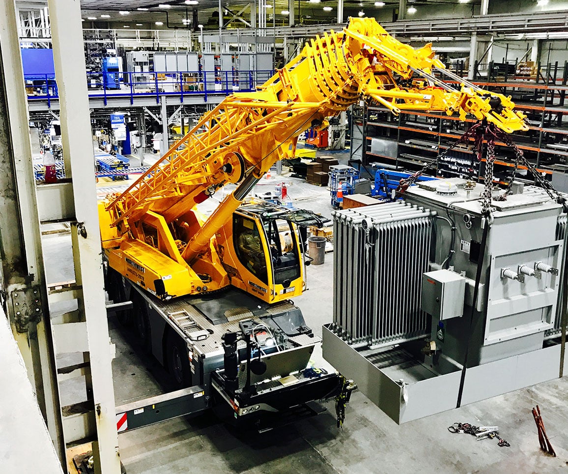 small crane inside warehouse